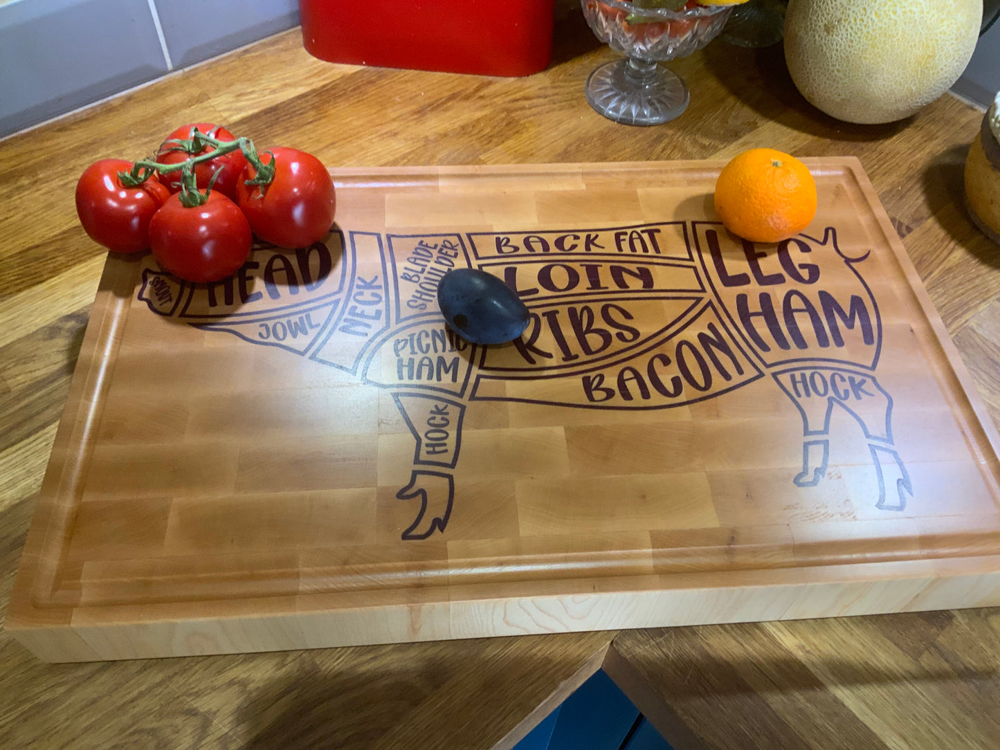 Custom Pig Cuts cutting board with fruit