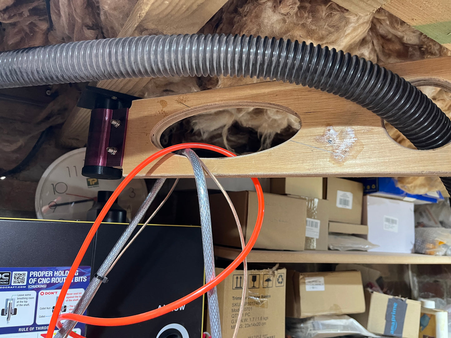Dust hose arm assembly ceiling mount