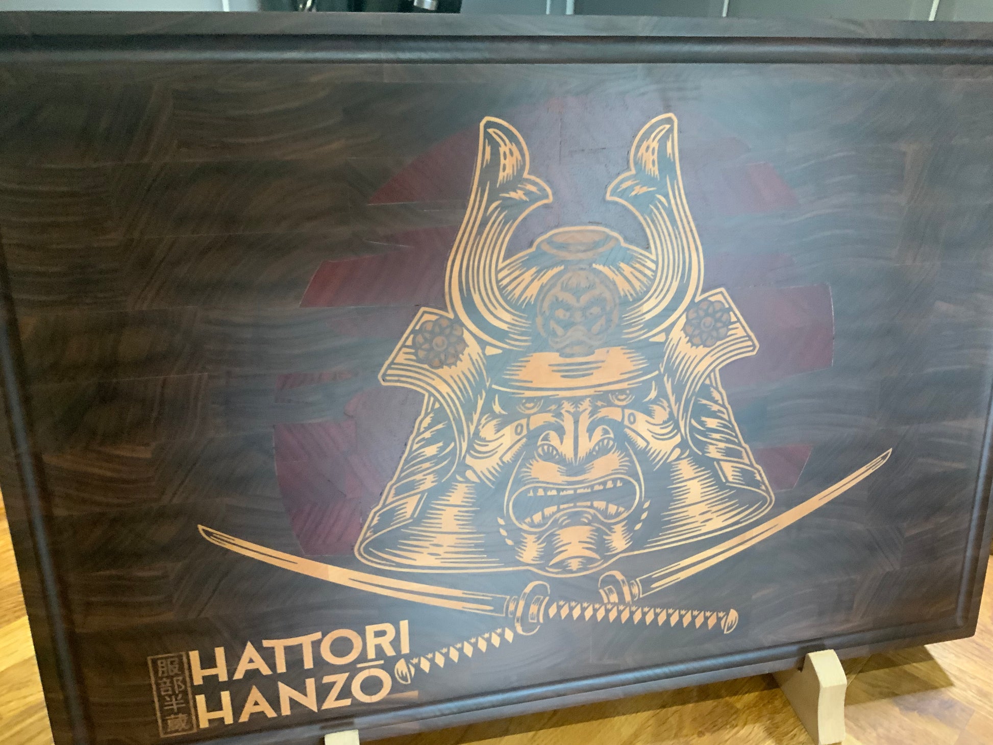 Custom cutting board featuring Hattori Hanzo inlay